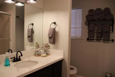 a bathroom with a sink and a mirror at Casa Mariposa - A Foothill Retreat near Yosemite in Mariposa