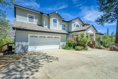 a large house with a garage at 11 Acre Mountain Spirit Retreat in North Fork
