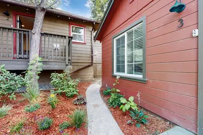 a red house with a garden in front of it at Manzanita Holiday in South Lake Tahoe