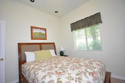 a bedroom with a bed and a window at Brummett Lodge Winter Special Ends 51226 in Bass Lake