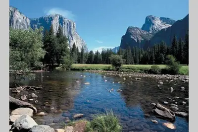 a river with rocks and mountains in the background at Brummett Lodge Winter Special Ends 51226 in Bass Lake