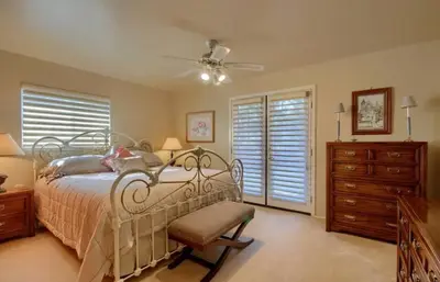 a bedroom with a bed and a ceiling fan at Robins Nest- Lake Area Free Night Special in Bass Lake