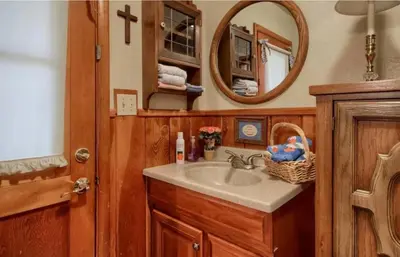 a bathroom with a sink and a mirror at Robins Nest- Lake Area Free Night Special in Bass Lake