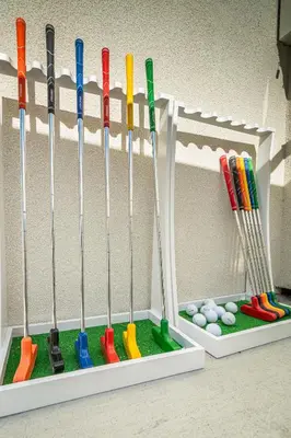 a bunch of baseball bats in a holder at Urban Haven in Reno: Charming Studio Retreat in Reno