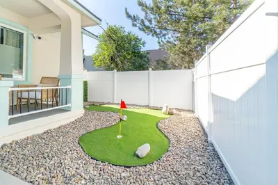 a miniature golf course in the yard of a house at Reno Dream Cottage: Delightful 2-Bedroom Sanctuary in Reno