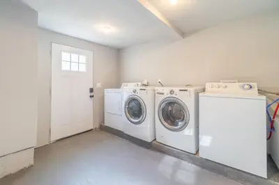 a laundry room with a washer and dryer at Reno Dream Cottage: Delightful 2-Bedroom Sanctuary in Reno