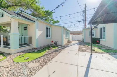 a house with a golf course in the yard at Reno Oasis: Stylish 1-Bedroom Escape in Reno