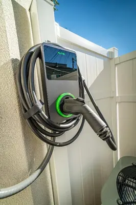 a cell phone is hooked up to a wall at Reno Oasis: Stylish 1-Bedroom Escape in Reno