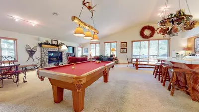 a living room with a pool table in it at Snowcreek V #757 condo in Mammoth Lakes