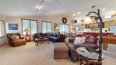 a large living room with couches and a table at Snowcreek V #757 condo in Mammoth Lakes