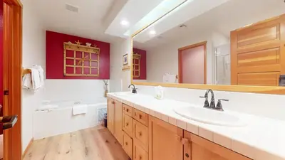 a bathroom with a sink and a large mirror at Snowcreek V #757 condo in Mammoth Lakes