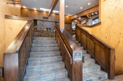 a staircase in a house with wooden walls and wooden floors at Club Tahoe Resort in Incline Village