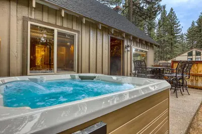 a large hot tub in front of a house at Black Bear Hideaway in South Lake Tahoe