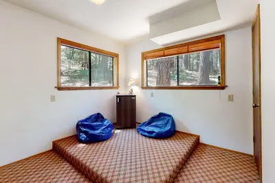 a room with two blue bags on a bed at Cresta Cabin in Arnold