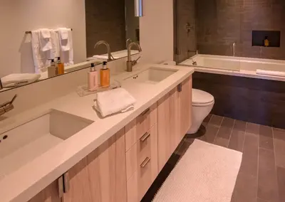 a bathroom with a sink and a tub and a toilet at Modern Ski In-Out Home, Mid-Mountain in Truckee