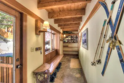 a hallway of a cabin with skis on the wall at Crystal Bay Lakeview in Crystal Bay
