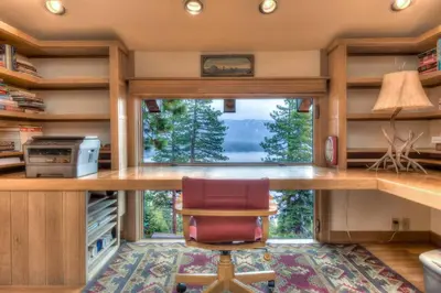 a kitchen with a desk and a large window at Crystal Bay Lakeview in Crystal Bay