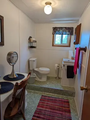 a bathroom with a toilet and a sink and a toilet istg at Moore's Cabin in Miramonte