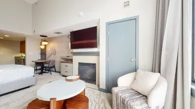 a living room with a couch and a fireplace at Village Monache #720 condo in Mammoth Lakes