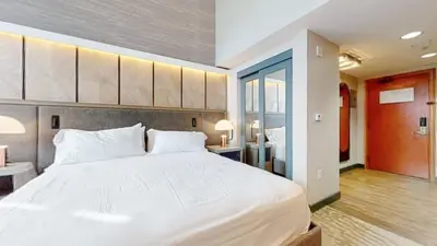 a bedroom with a large white bed in a room at Village Monache #720 condo in Mammoth Lakes