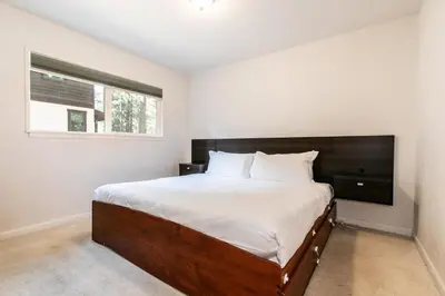 a bedroom with a large bed and a window at Agate Bay 3BDR, Walking Distance to the Beach! in Tahoe Vista