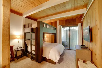 a bedroom with a bed and a tv in a room at Mammoth Lakes Vacation Rental 1 Mi to Ski Area! in Mammoth Lakes