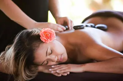 a woman getting a back massage from a therapist at Purple Orchid Resort & Spa in Livermore