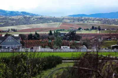 a small town in a field with a farm at Purple Orchid Resort & Spa in Livermore