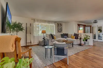 a living room with a couch and a table at @ Marbella Lane - Eccentric 4BR Modern Ranch Home in Reno