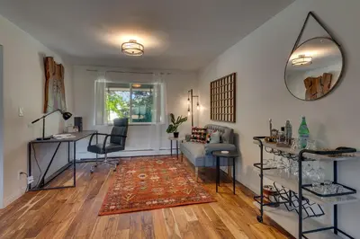 a living room with a couch and a mirror at @ Marbella Lane - Eccentric 4BR Modern Ranch Home in Reno