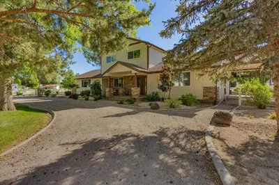 a house with a driveway in front of it at @ Marbella Lane - Eccentric 4BR Modern Ranch Home in Reno