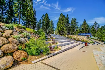a row of stone steps next to a rock wall at Hounds of Aspen in South Lake Tahoe