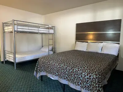 a bedroom with a bed and a bunk bed at Elevation Lodge in South Lake Tahoe