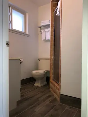 a bathroom with a toilet and a window at Elevation Lodge in South Lake Tahoe