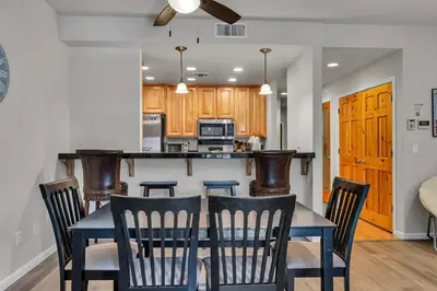 a dining room and kitchen with a table and chairs at 2BDR Condo - Three Minutes to Olympic Valley! in Tahoe City
