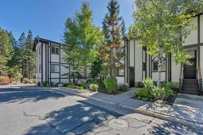 an empty street in front of a building at 2BDR Condo - Three Minutes to Olympic Valley! in Tahoe City