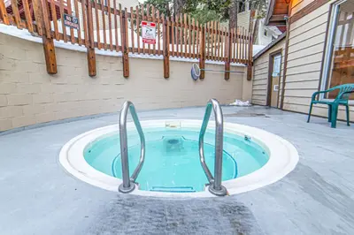 a small swimming pool in the middle of a patio at Mammoth Lakes Condo with Fireplace and Mountain Views in Mammoth Lakes