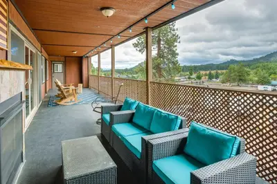 a screened porch with chairs and tables on a balcony at Game Room, Mtn Views! Unit 1 Mi to Heavenly Resort in Stateline