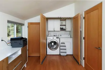 a laundry room with a washing machine in it at The Haven -In Town, NEWLY remodeled, Private, Stocked in Mariposa