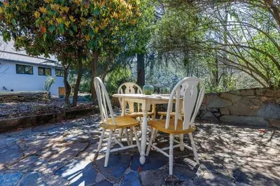 a table and two chairs sitting around a table at The Haven -In Town, NEWLY remodeled, Private, Stocked in Mariposa
