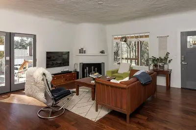 a living room with a couch and a fireplace at The Haven -In Town, NEWLY remodeled, Private, Stocked in Mariposa