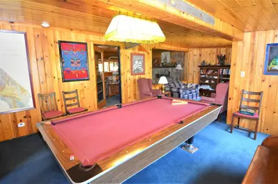 a pool table in a room with wooden walls at O'Connell-Lake Area Free Night Special in Bass Lake