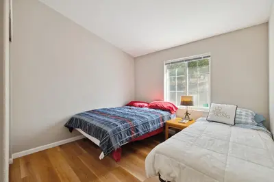 a bedroom with two beds and a window at Newly Renovated Retreat on 6 Acres, Discover Murphys Lodge with Scenic Views! in Murphys