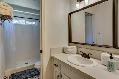 a bathroom with a sink and a mirror and a toilet at Pet-Friendly Coarsegold Vacation Rental with Deck! in Coarsegold