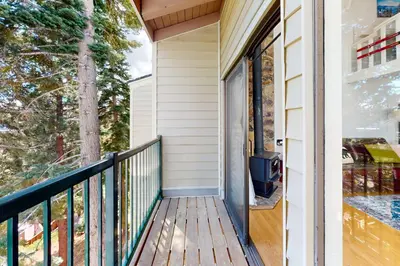 a balcony with a view of the trees at Sunrise Serenity at Tahoe Village in Stateline