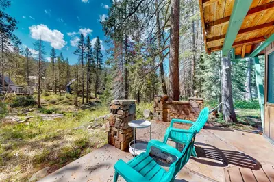 a patio with two chairs and a table on a house at Sierra Secret in Soda Springs
