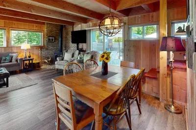 a dining room with a wooden table and chairs at Fernwood in Shaver Lake