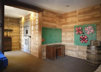 a room with wooden walls and darts on the wall at Hyatt Vacation Club at Northstar Lodge in Truckee