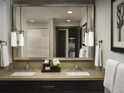a bathroom with two sinks and a large mirror at Hyatt Vacation Club at Northstar Lodge in Truckee