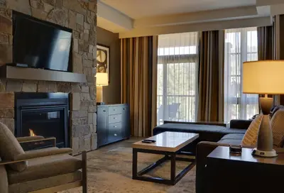 a living room with a couch and a fireplace at Hyatt Vacation Club at Northstar Lodge in Truckee
